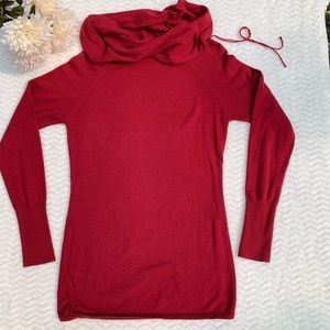 Women’s red turtleneck sweater with tie detail